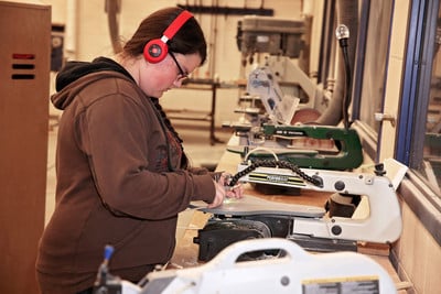 student working in shop class